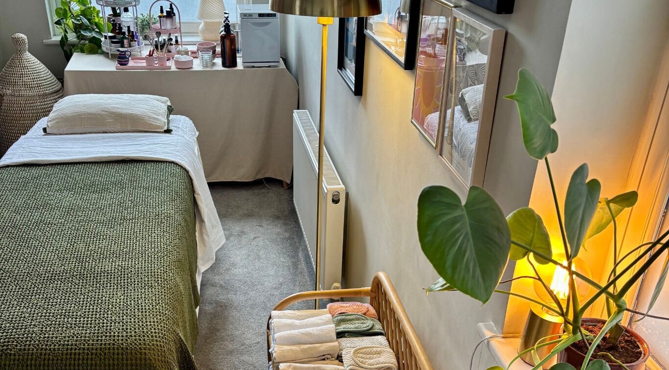 Cozy therapy room at Aceso Healing Therapies, Margate, England, GB with a neatly made bed and calming decor.