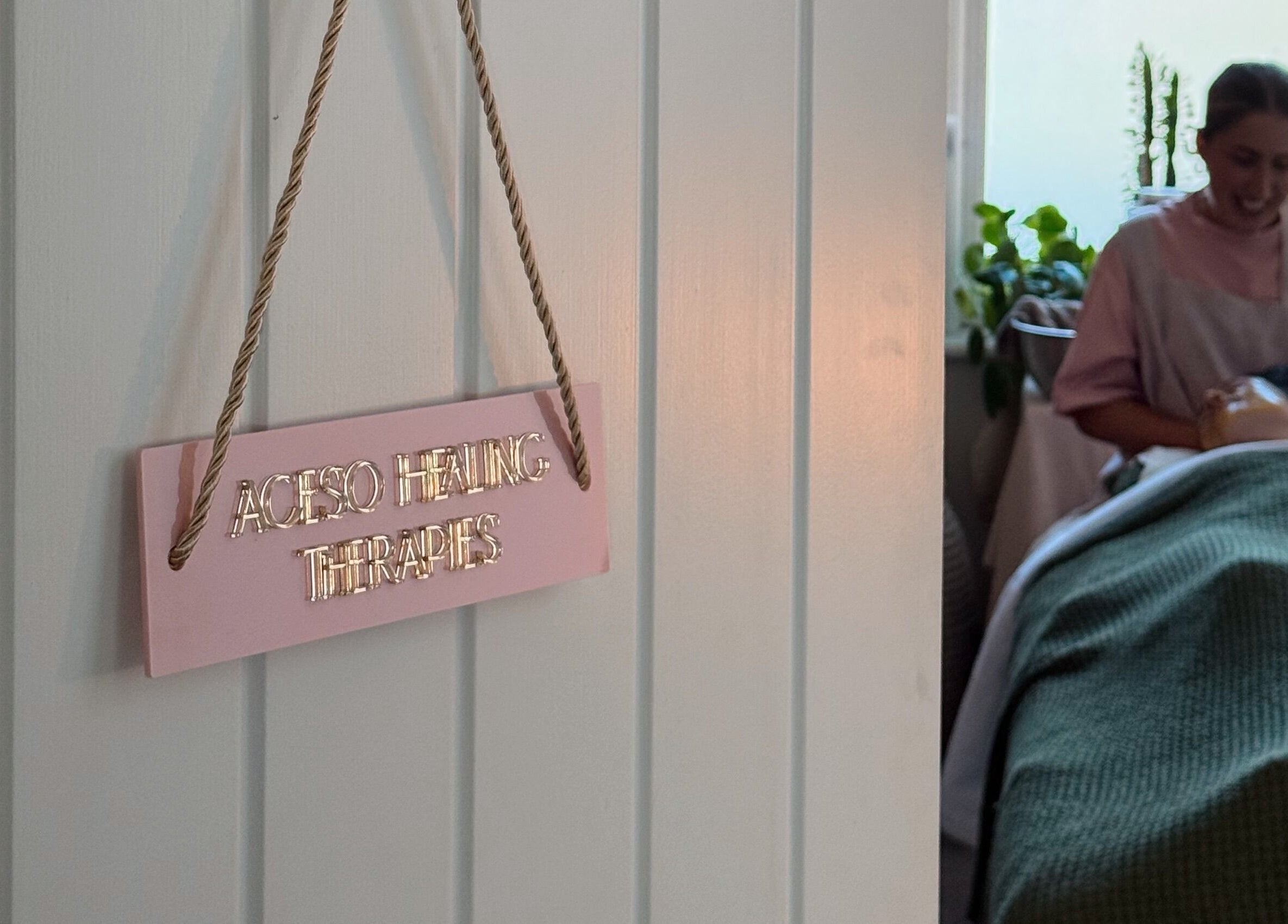 Aceso Healing Therapies room in Margate, England, GB shows a cozy ambiance with a therapist at work.