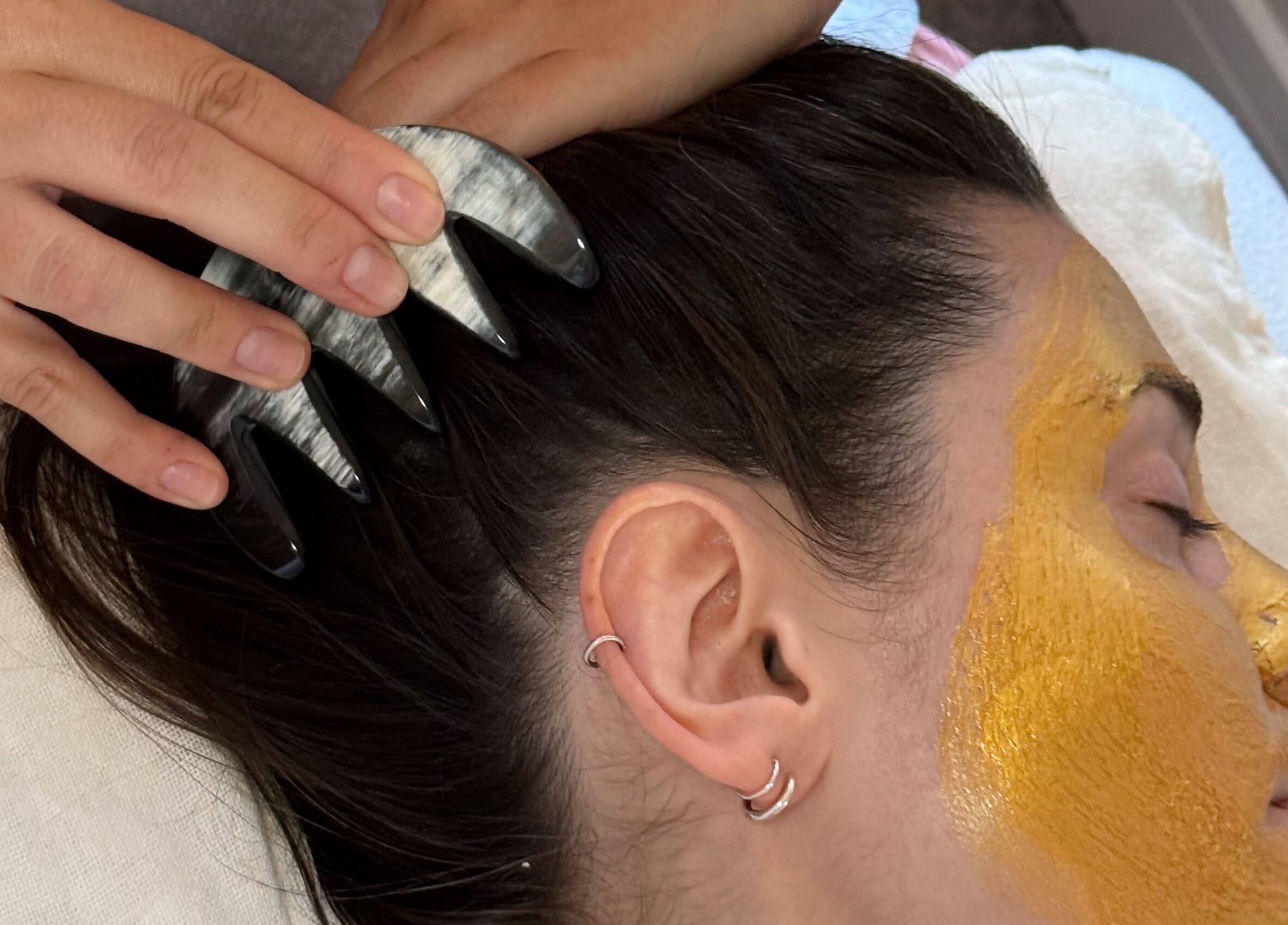 Gua Sha scalp treatment with turmeric mask at Aceso Healing Therapies, Margate, England, GB.