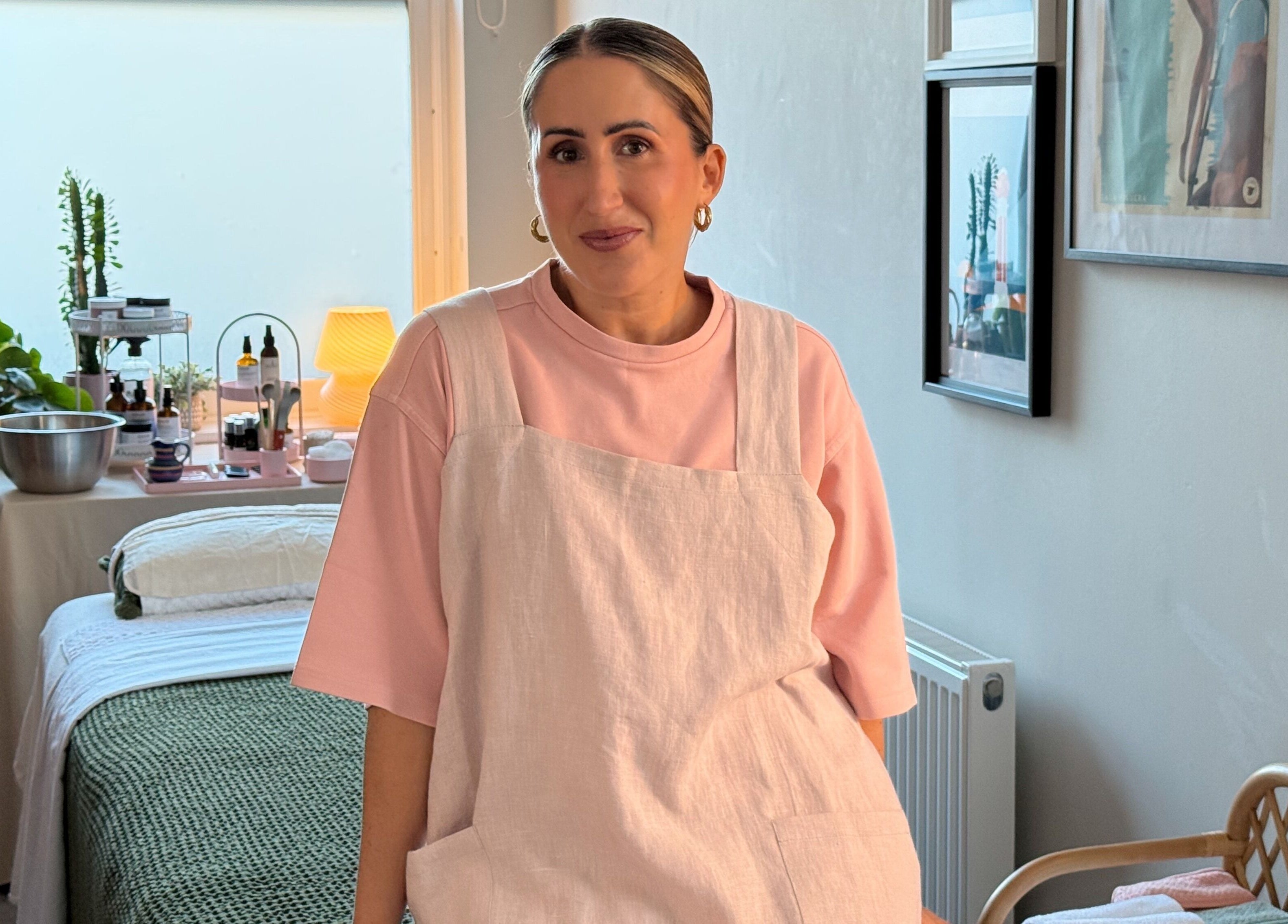 Therapist at Aceso Healing Therapies, Margate, England, GB, in a cozy treatment room.