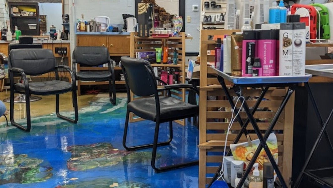 Interior of apPIERances Salon & Barbering in Lititz, Pennsylvania, US, featuring stylish seating and hair products.
