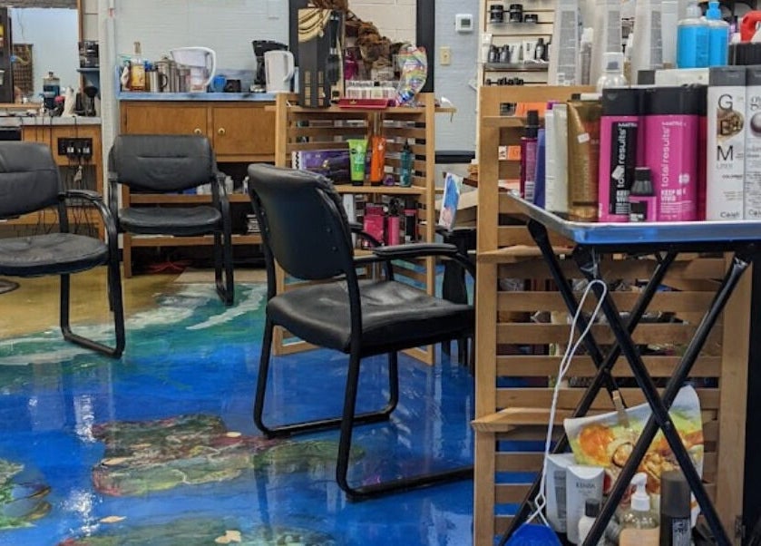 Interior of apPIERances Salon & Barbering in Lititz, Pennsylvania, US, featuring stylish seating and hair products.