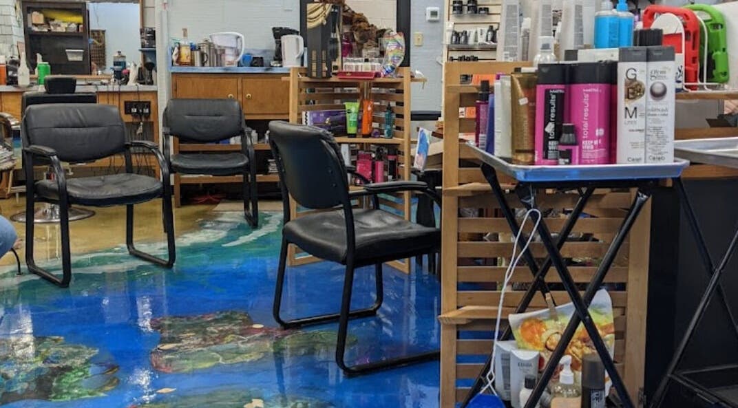 Interior of apPIERances Salon & Barbering in Lititz, Pennsylvania, US, featuring stylish seating and hair products.