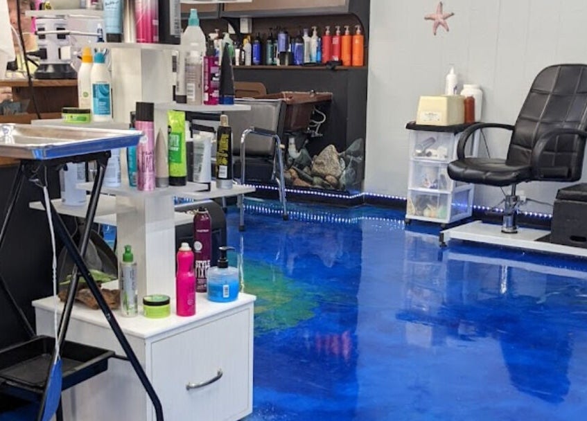 Modern salon interior at apPIERances Salon & Barbering, Lititz, Pennsylvania, US, featuring vibrant blue flooring.