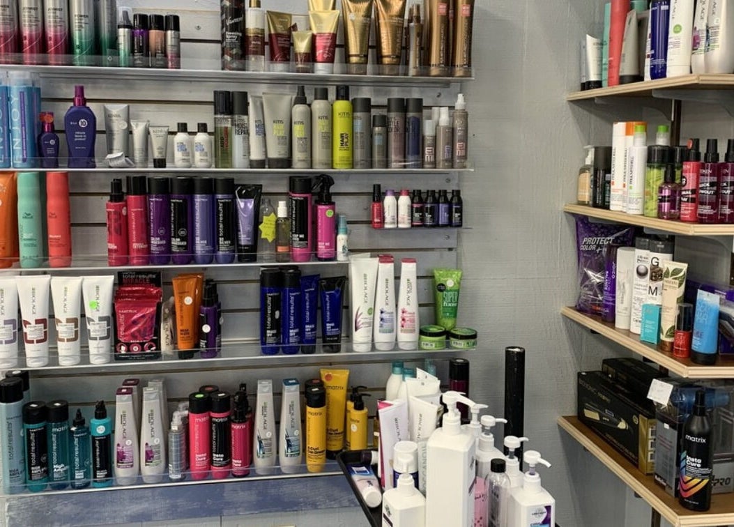 A variety of hair care products neatly arranged on shelves at apPIERances Salon & Barbering, Lititz, Pennsylvania, US.