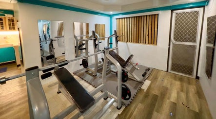 Modern workout equipment at Detox Wellness, San Fernando, Ilocos Region, PH, offering a serene fitness environment.