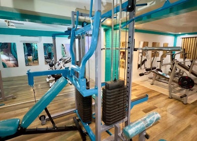 Modern gym equipment in a bright setting at Detox Wellness, San Fernando, Ilocos Region, PH.