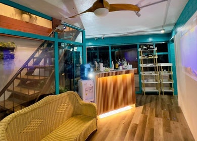 Inviting interior of Detox Wellness, San Fernando, Ilocos Region, PH, showcasing a cozy lounge area with wicker seating.