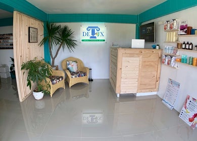 Reception area at Detox Wellness, San Fernando, Ilocos Region, PH featuring cozy chairs and inviting decor.