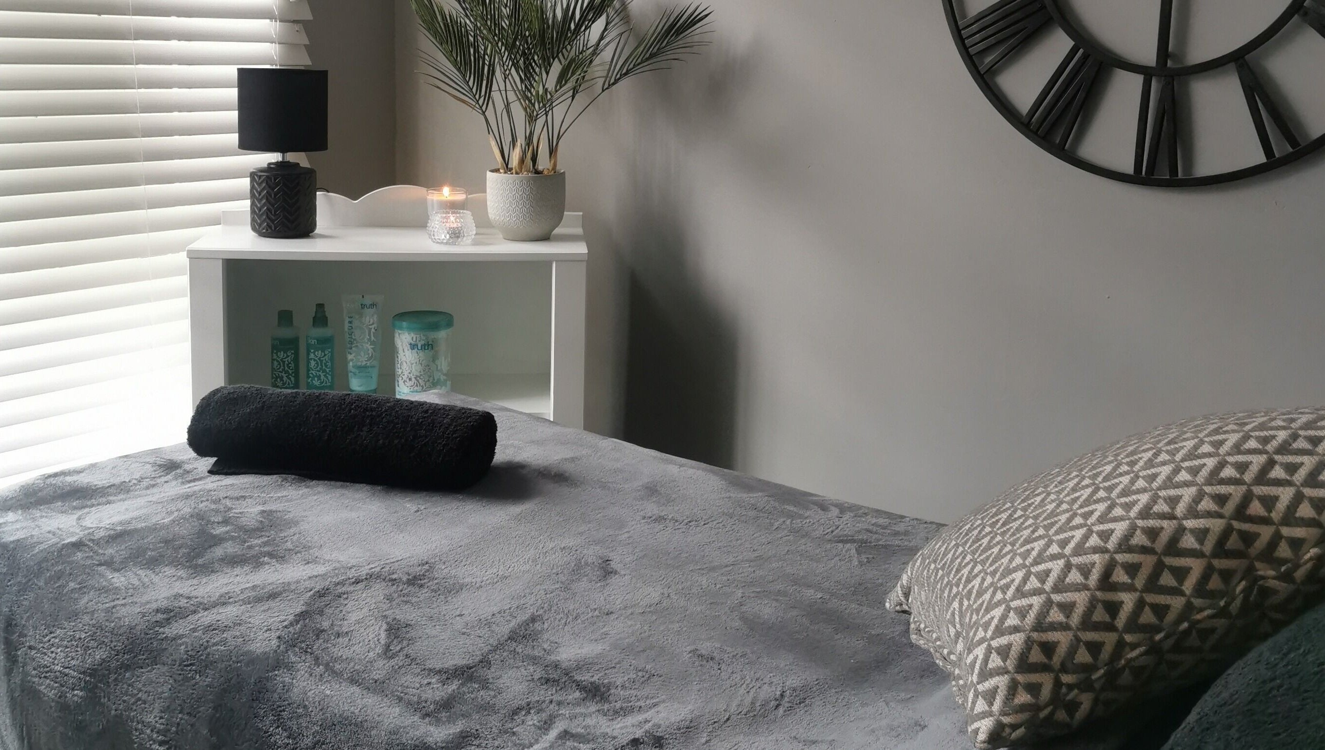 Relaxing spa room at True Beauty Boroughbridge, Boroughbridge, England, GB with plush bed and cozy decor.