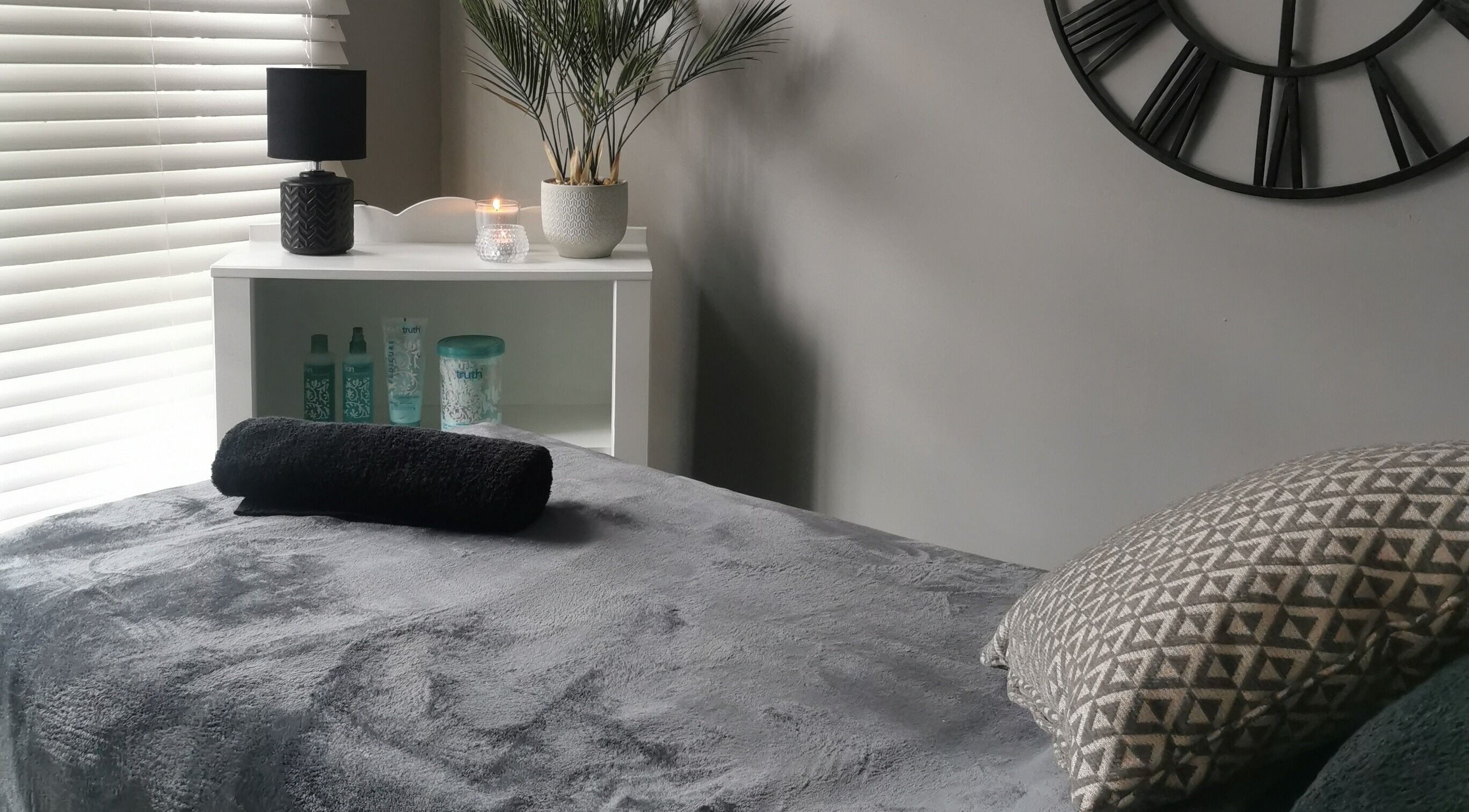 Relaxing spa room at True Beauty Boroughbridge, Boroughbridge, England, GB with plush bed and cozy decor.