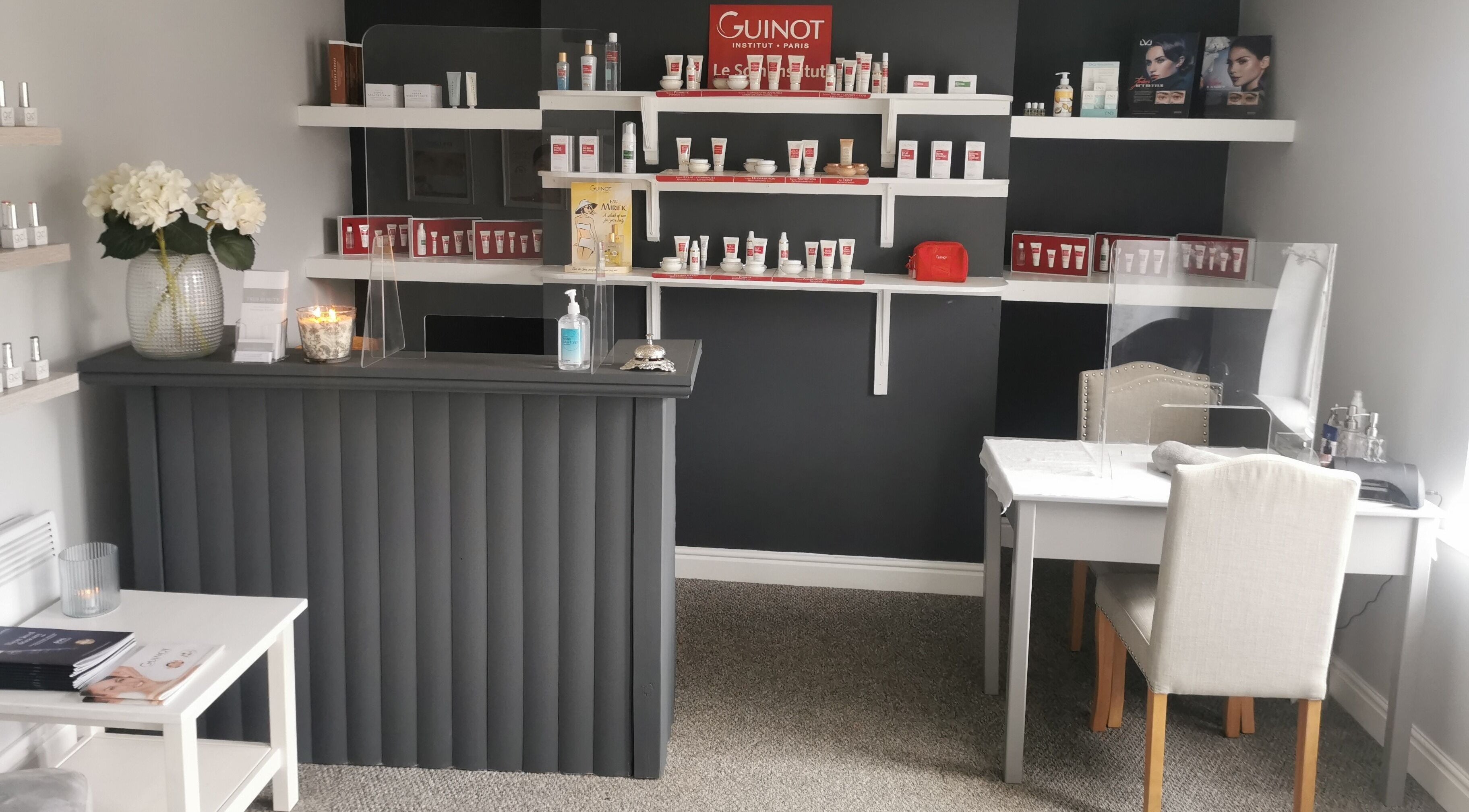 Stylish beauty counter at True Beauty Boroughbridge in Boroughbridge, England, GB with elegant product displays.