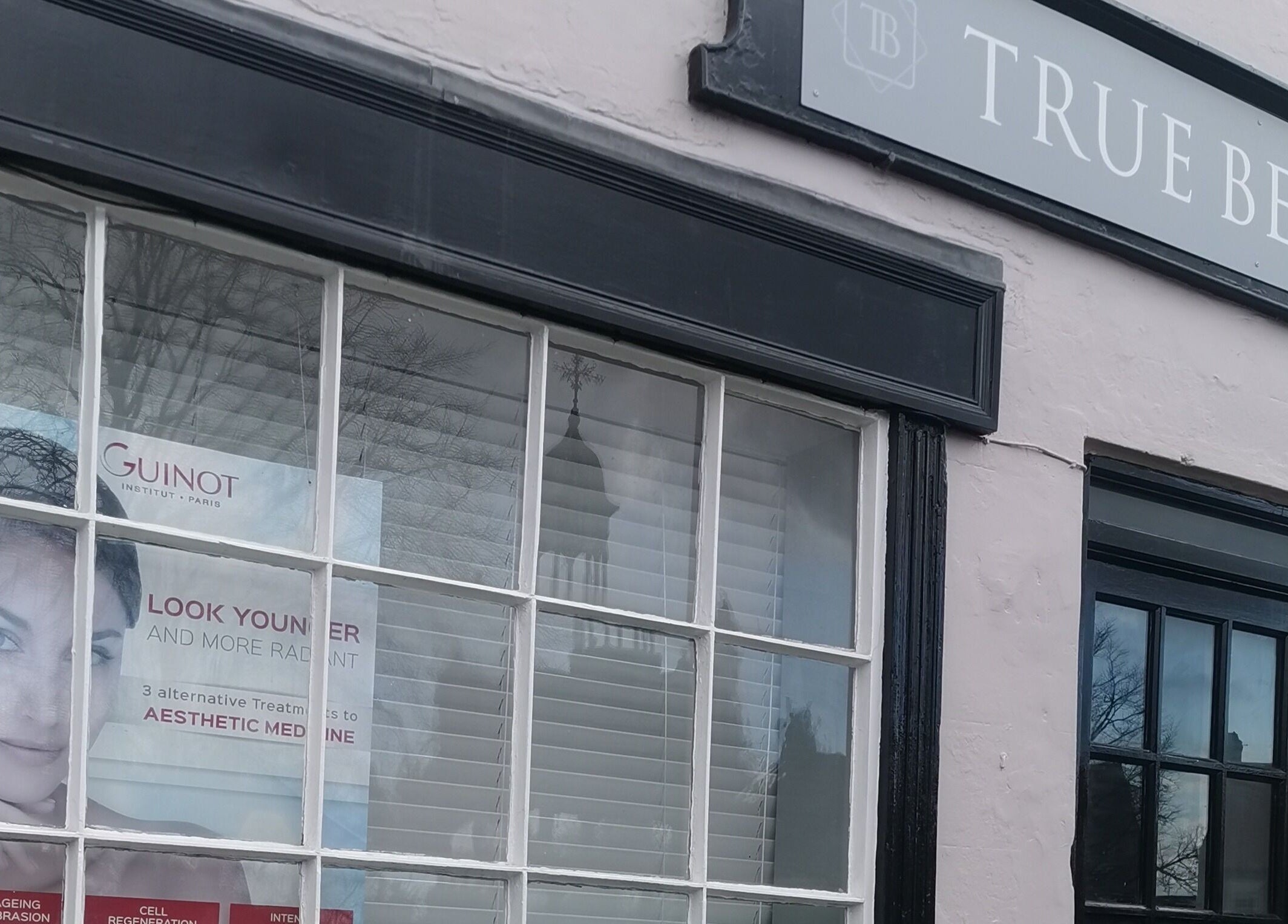Shopfront of True Beauty Boroughbridge in Boroughbridge, England, GB, showcasing a poster of skincare services.