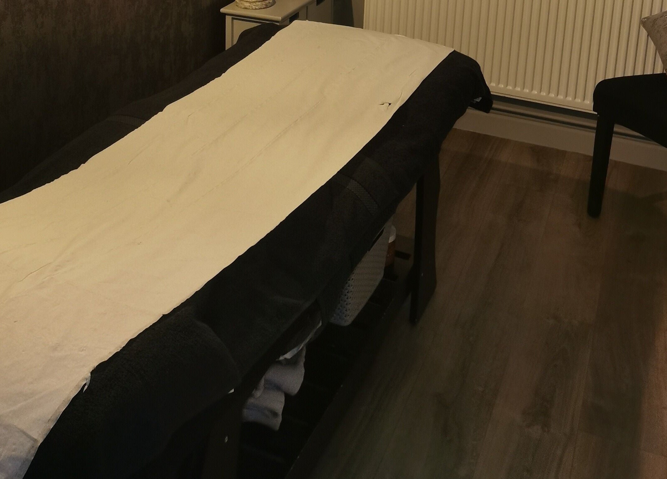 A cozy treatment room at True Beauty Boroughbridge, Boroughbridge, England, GB, featuring a massage table.