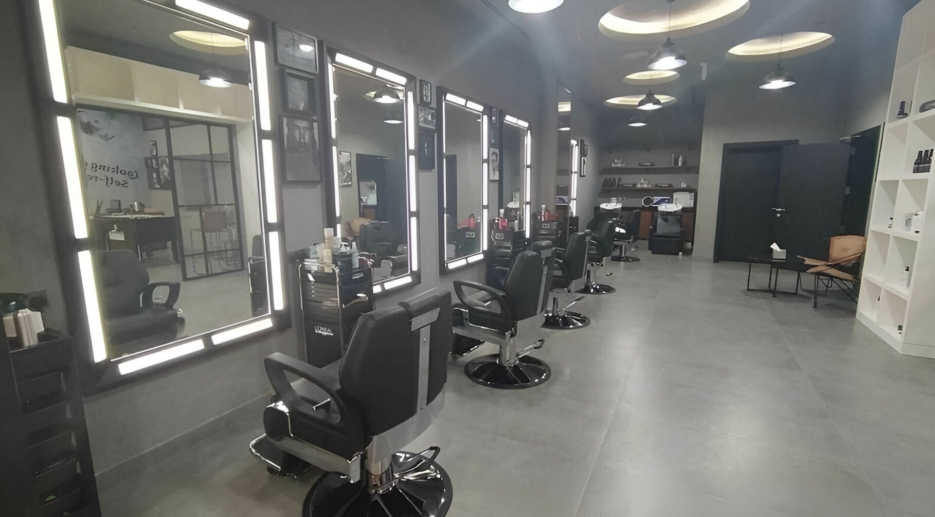 Interior of Le Coiffeur Salon Dar-Al-Salam, showcasing sleek salon chairs in الدوحة, الريان, QA.