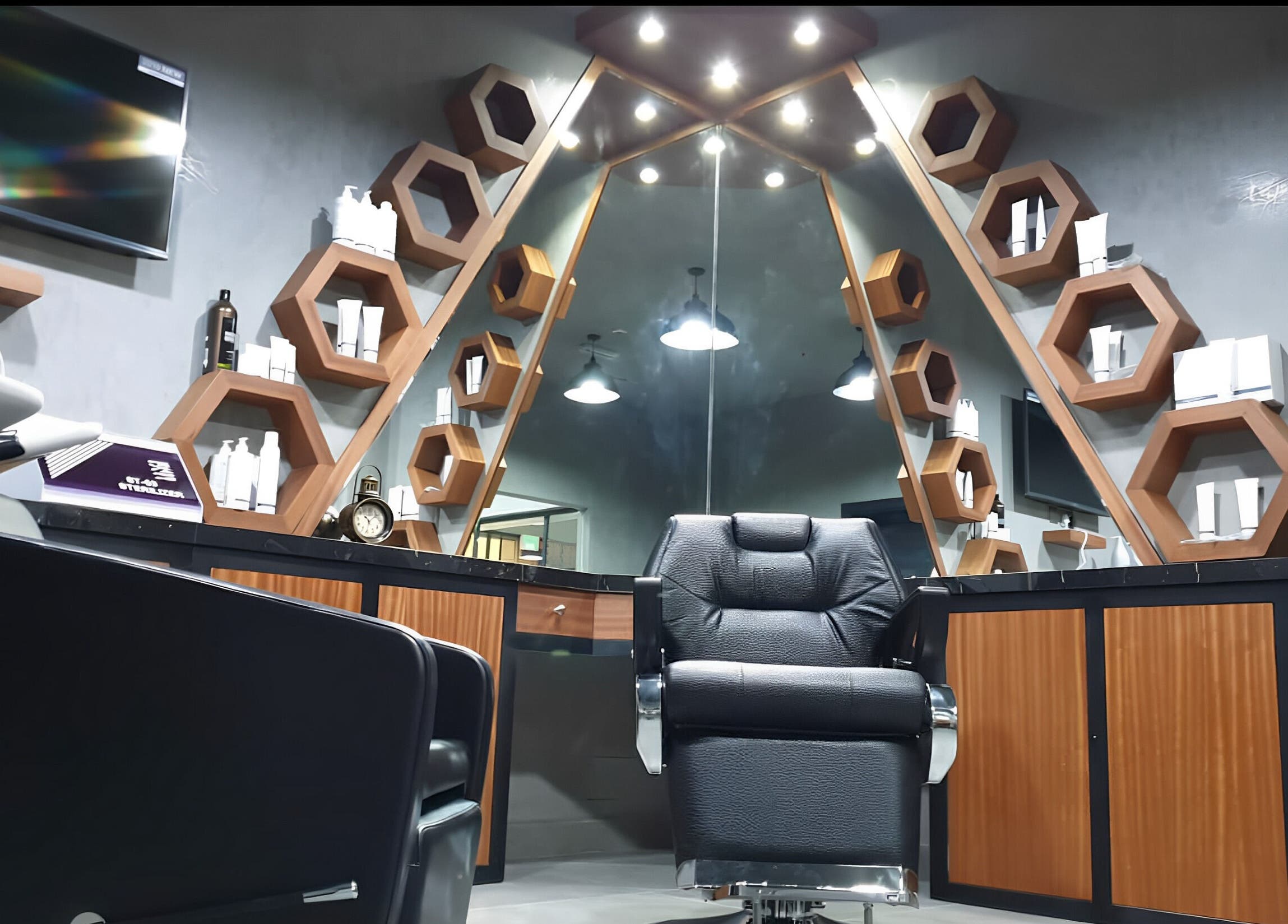 Modern styling area at Le Coiffeur Salon Dar-Al-Salam, الدوحة, الريان, QA with sleek chair and hexagon shelves.