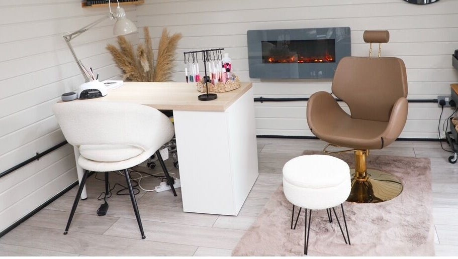 Stylish salon interior at Bennett’s Beauty Bar in Liskeard, England, GB showcasing elegant seating and decor.