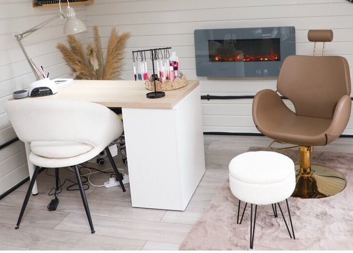 Stylish salon interior at Bennett’s Beauty Bar in Liskeard, England, GB showcasing elegant seating and decor.