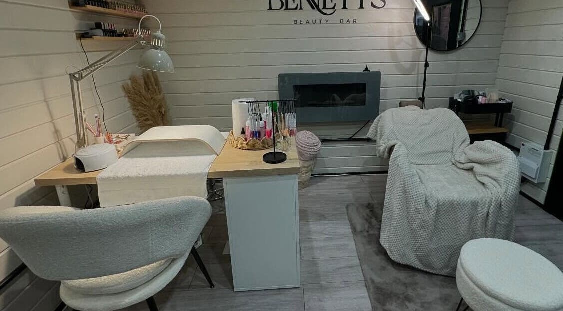 Nail service area at Bennett’s Beauty Bar, Liskeard, England, GB, featuring plush seating and modern decor.