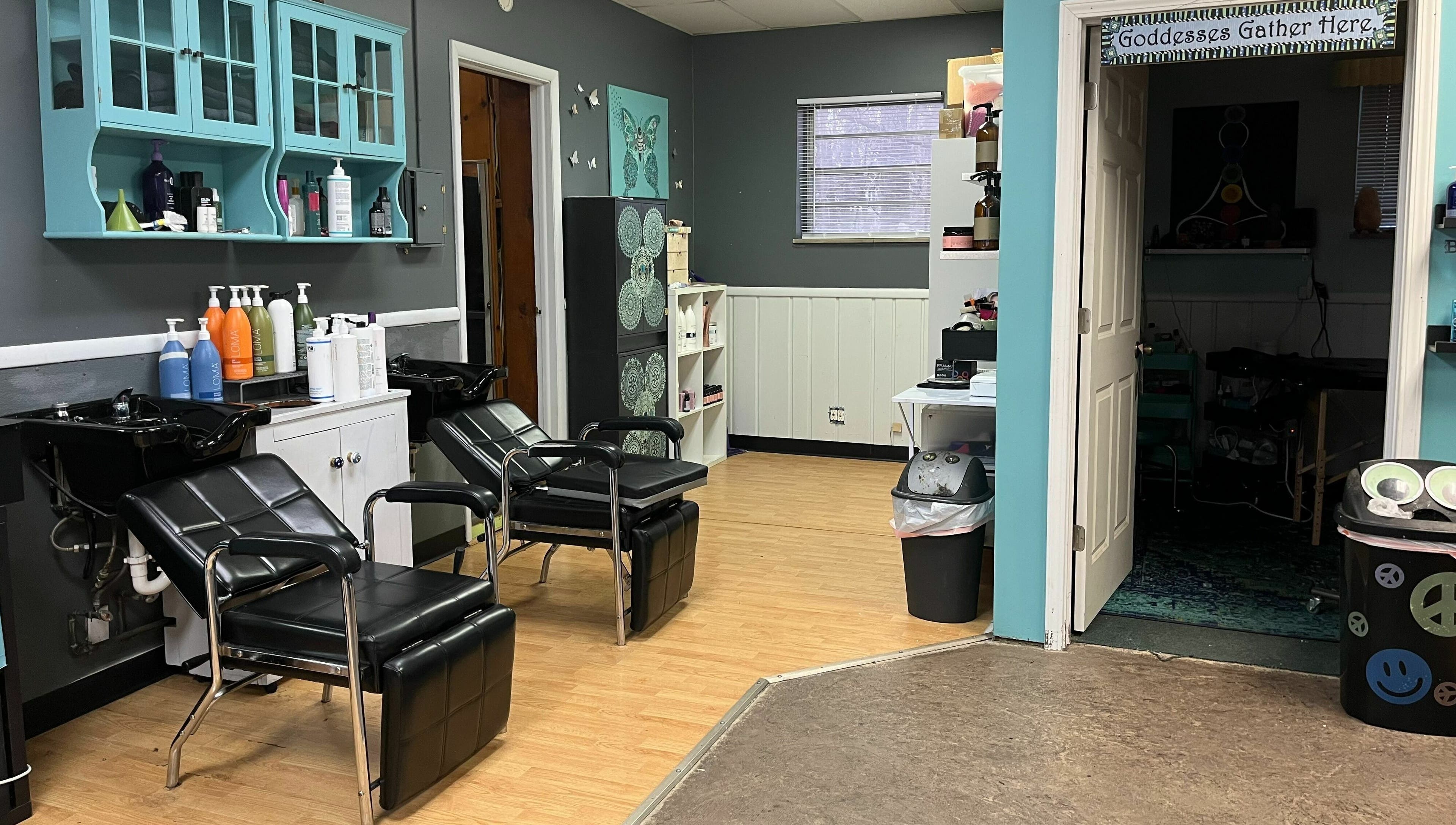 Chic salon interior at Aaries Styles Salon in Ypsilanti, Michigan, US with modern hair washing stations.