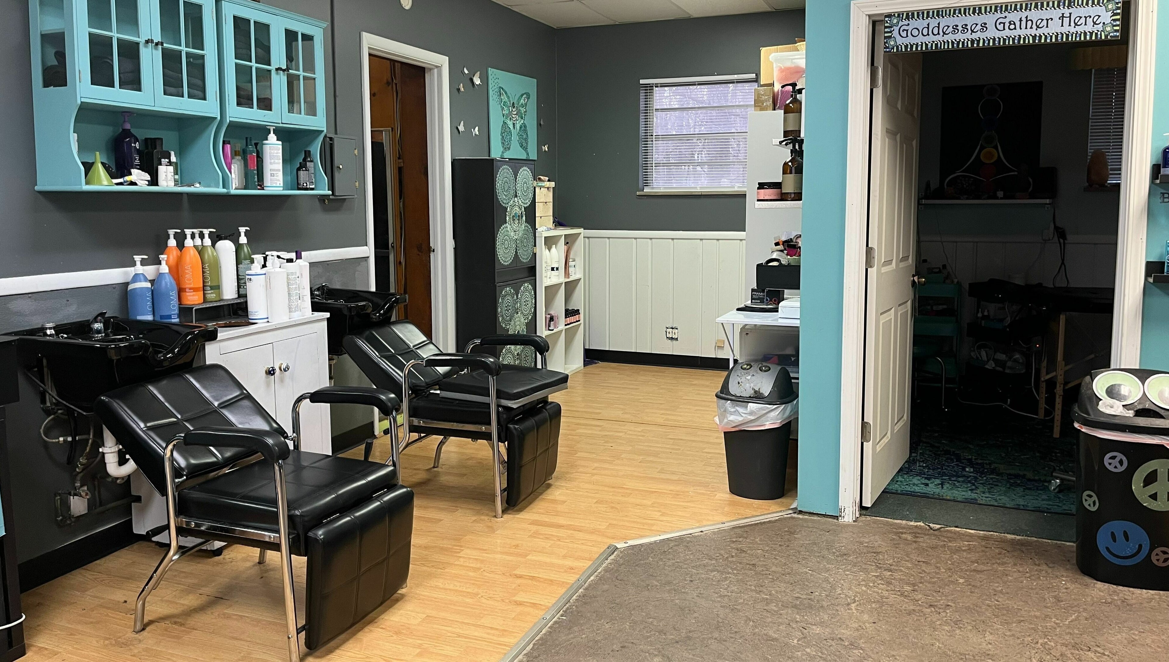 Chic salon interior at Aaries Styles Salon in Ypsilanti, Michigan, US with modern hair washing stations.