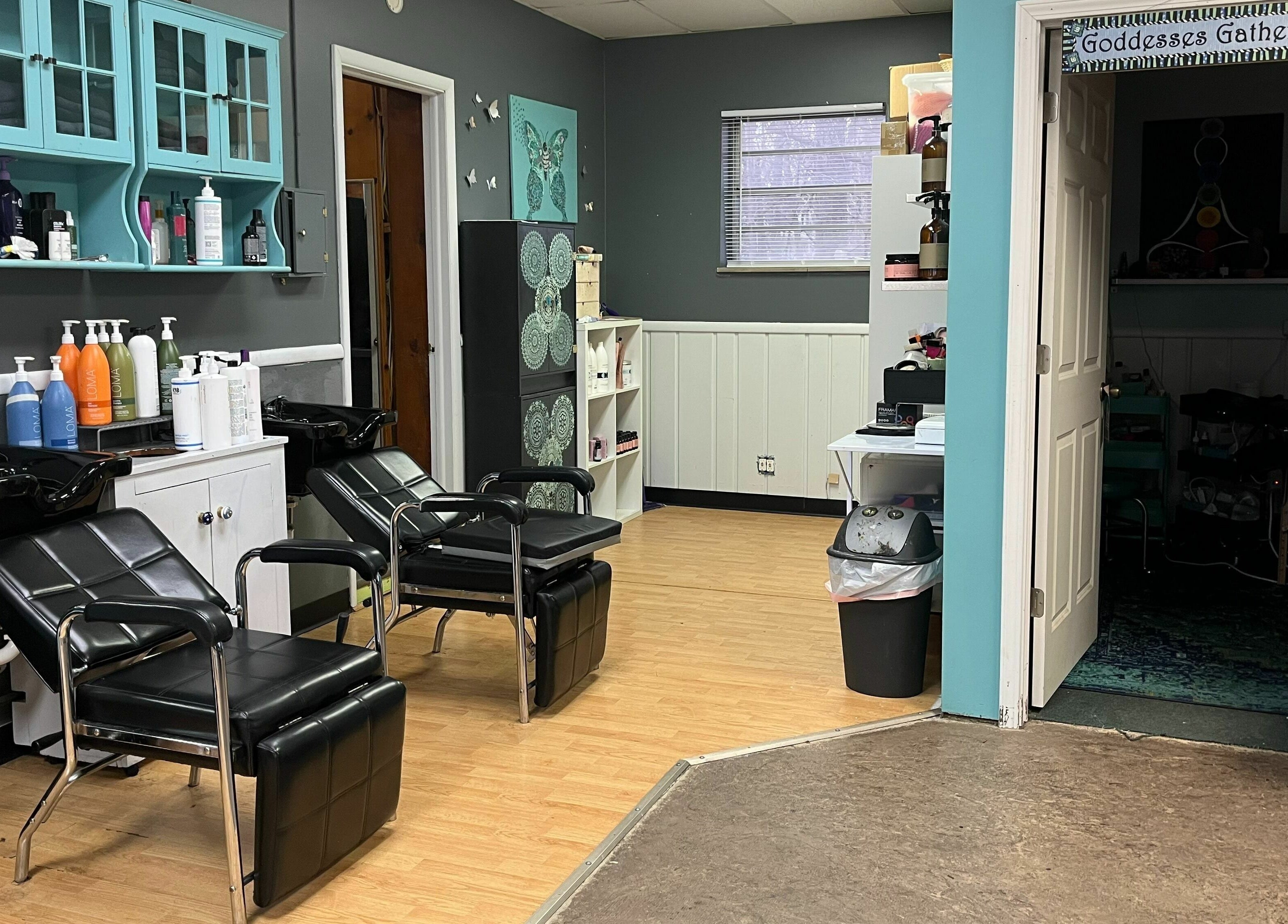 Chic salon interior at Aaries Styles Salon in Ypsilanti, Michigan, US with modern hair washing stations.