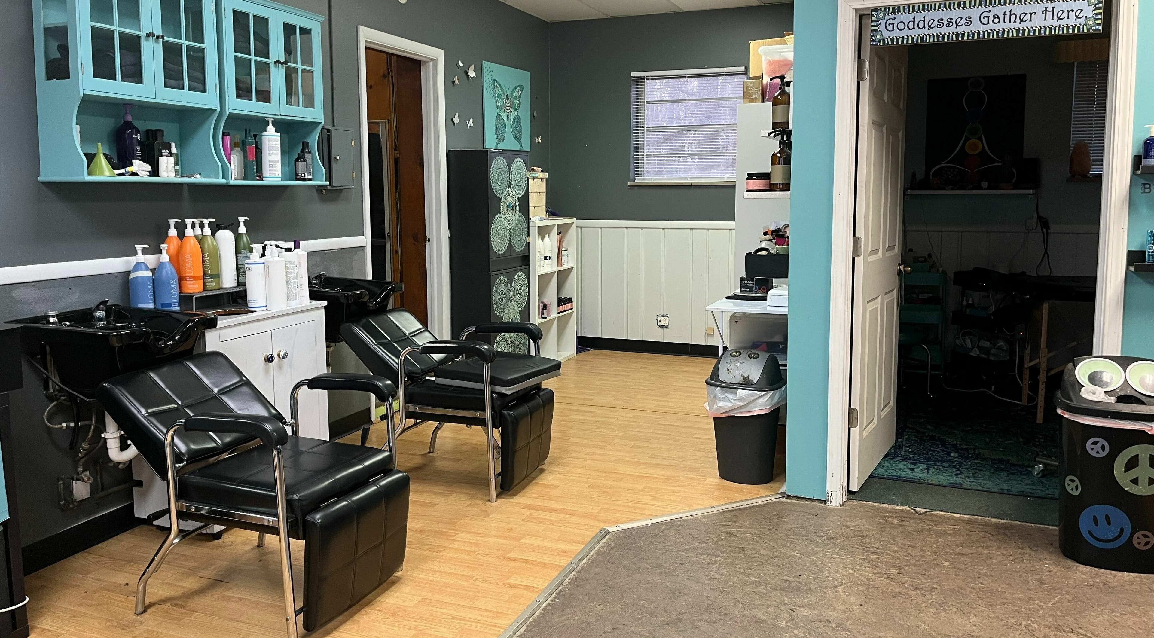 Chic salon interior at Aaries Styles Salon in Ypsilanti, Michigan, US with modern hair washing stations.