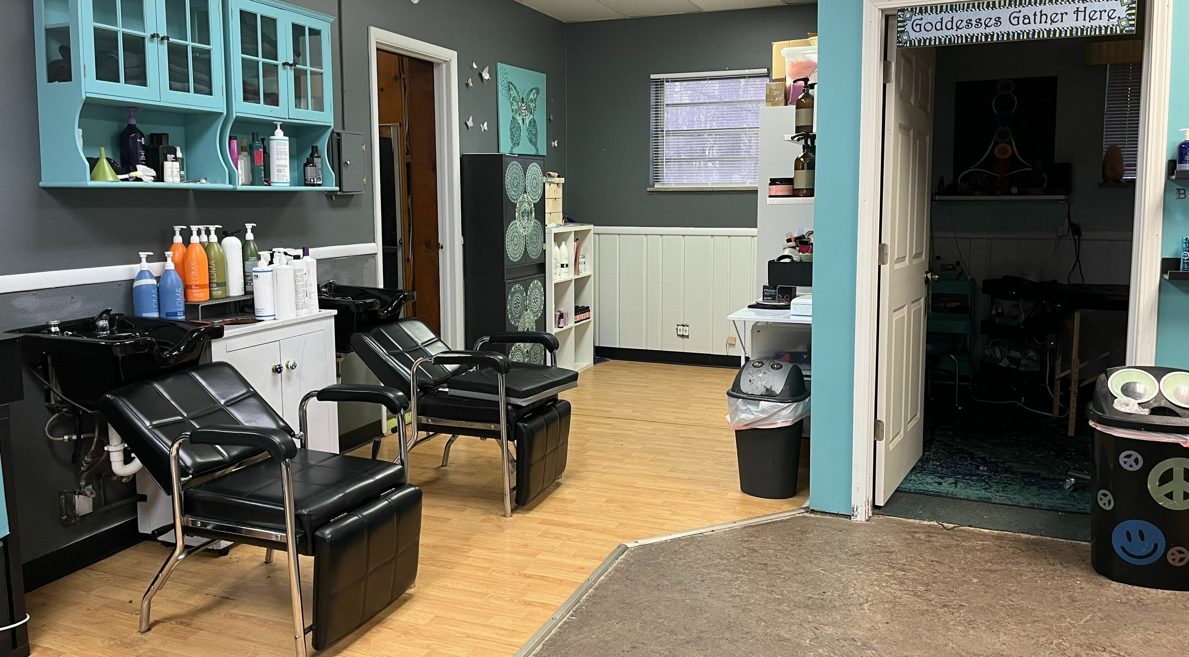 Chic salon interior at Aaries Styles Salon in Ypsilanti, Michigan, US with modern hair washing stations.