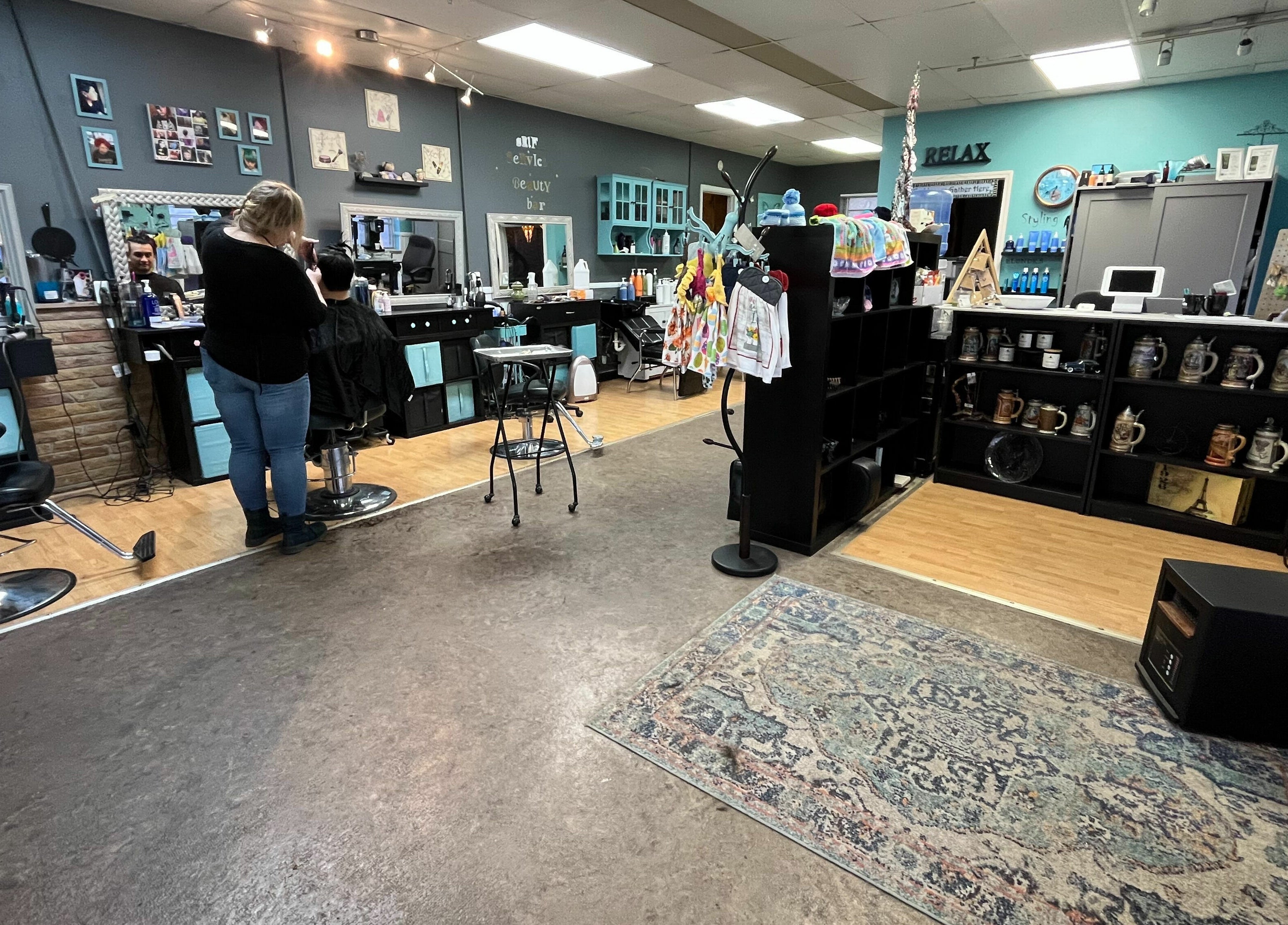 Cozy interior of Aaries Styles Salon in Ypsilanti, Michigan, US with stylish decor and salon chairs.