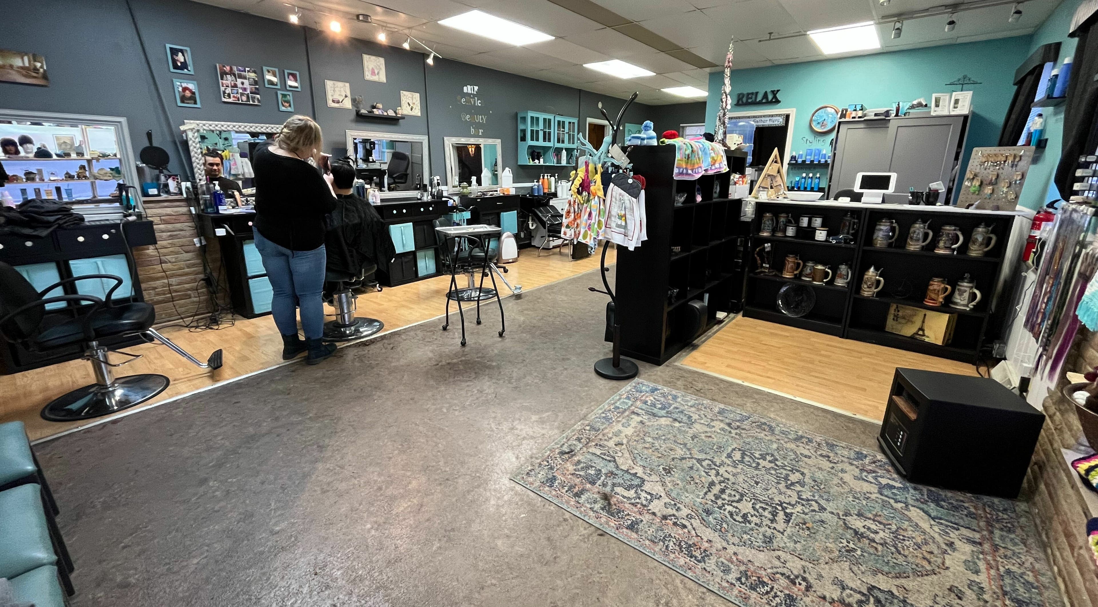 Cozy interior of Aaries Styles Salon in Ypsilanti, Michigan, US with stylish decor and salon chairs.
