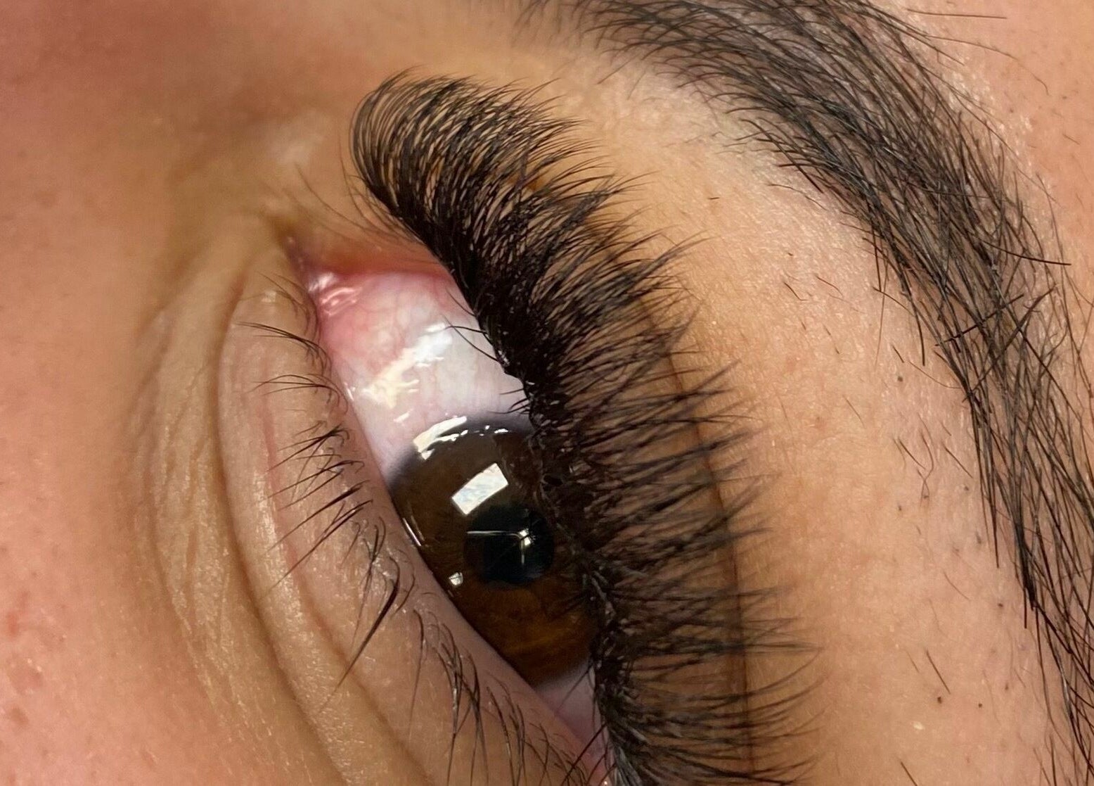 Close-up of expertly styled eyelashes at Aaries Styles Salon, Ypsilanti, Michigan, US.