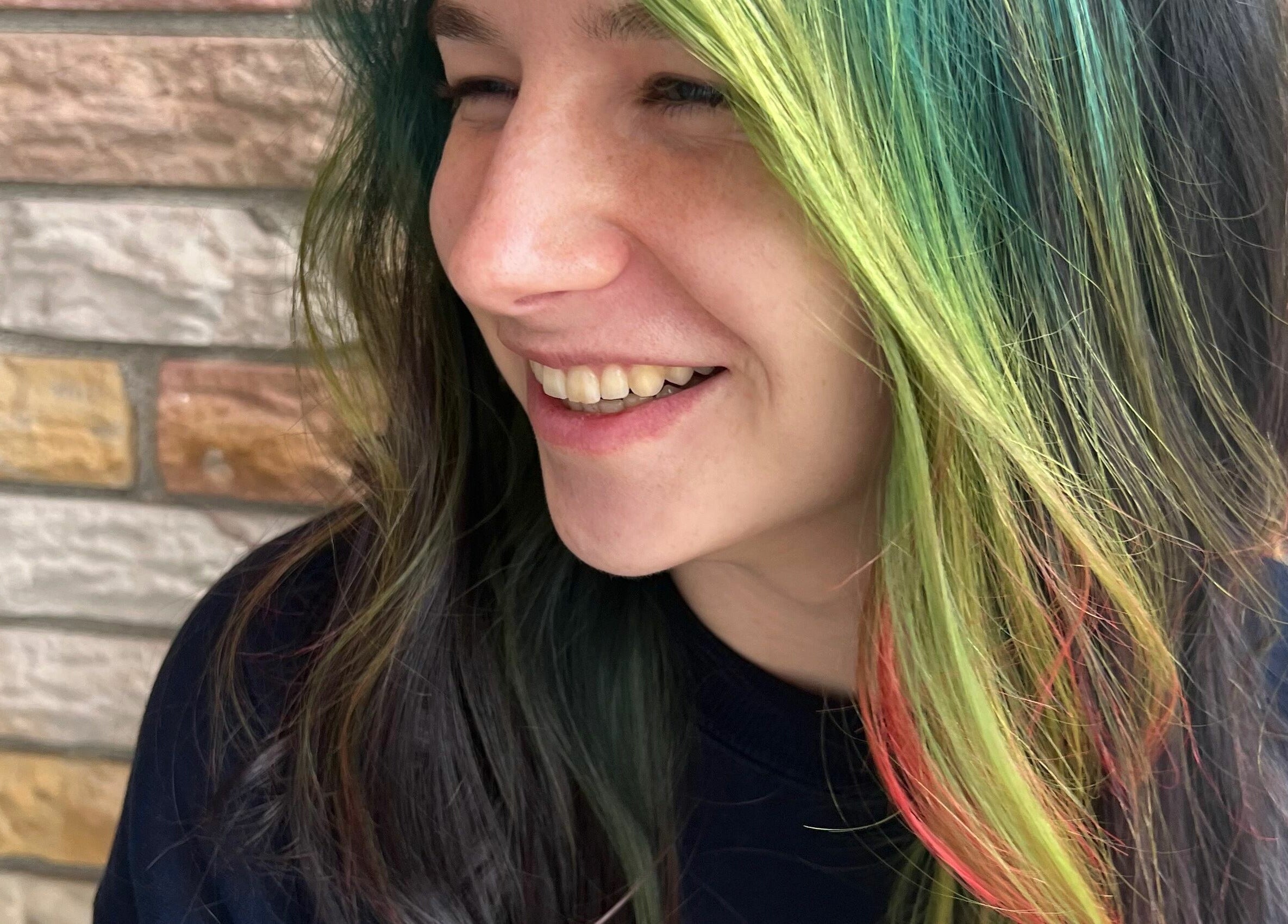 A vibrant hair color transformation at Aaries Styles Salon, Ypsilanti, Michigan, US.