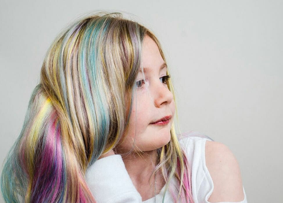 Colorful rainbow hair styled at Aaries Styles Salon in Ypsilanti, Michigan, US.
