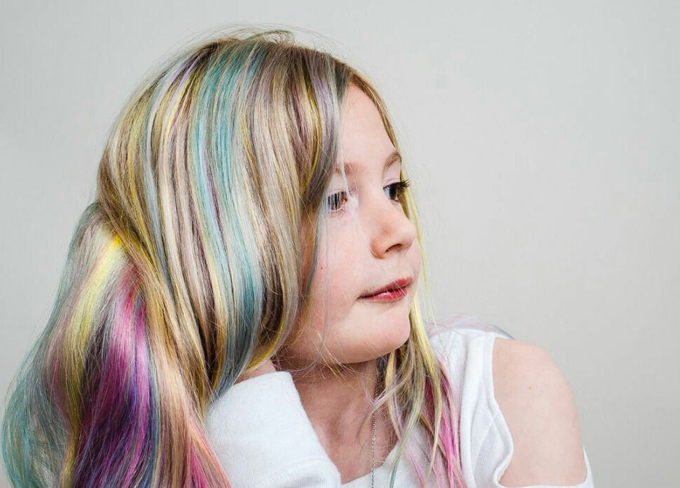 Colorful rainbow hair styled at Aaries Styles Salon in Ypsilanti, Michigan, US.