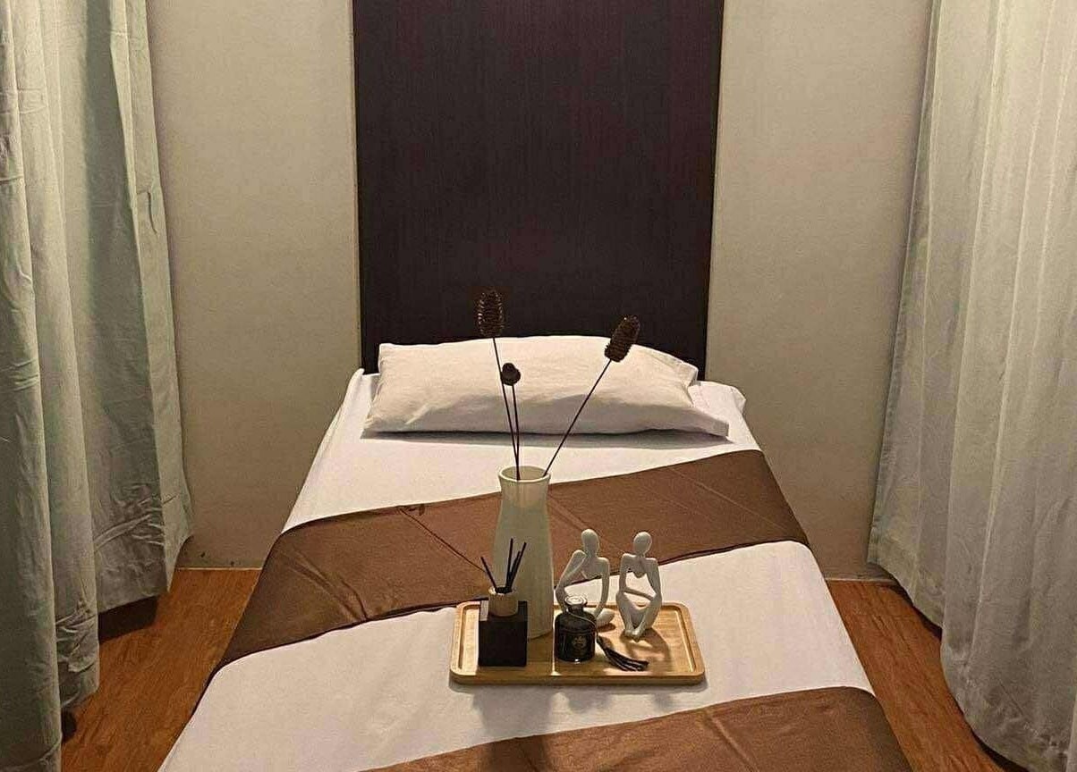 Relaxing massage room at Yuan Spa, City of Balanga, Central Luzon, PH with a cozy bed and calming decor.