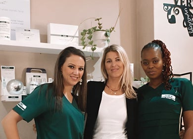 Team at Vertex Cosmetology, Cape Town, Western Cape, ZA, smiling warmly in a welcoming beauty setting.