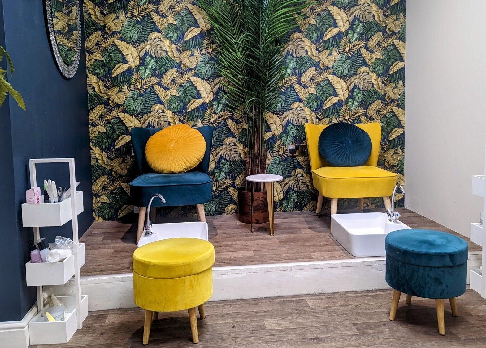 Cozy pedicure area at First Impressions, Shifnal, England, GB, featuring vibrant chairs and tropical decor.
