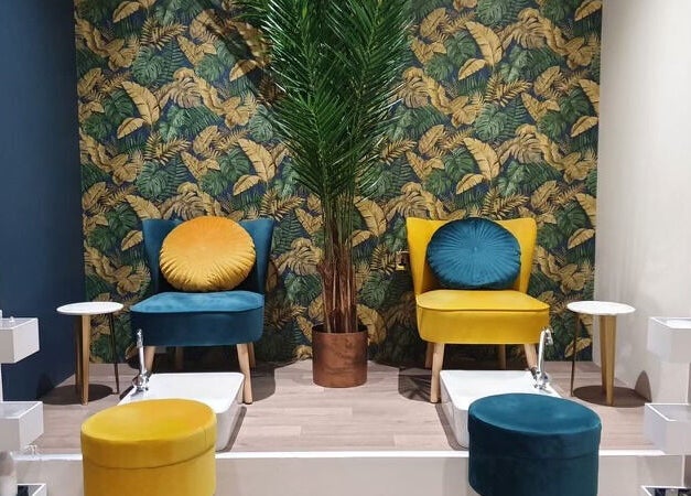 Elegant pedicure area at First Impressions, Shifnal, England, GB with stylish chairs and vibrant decor.