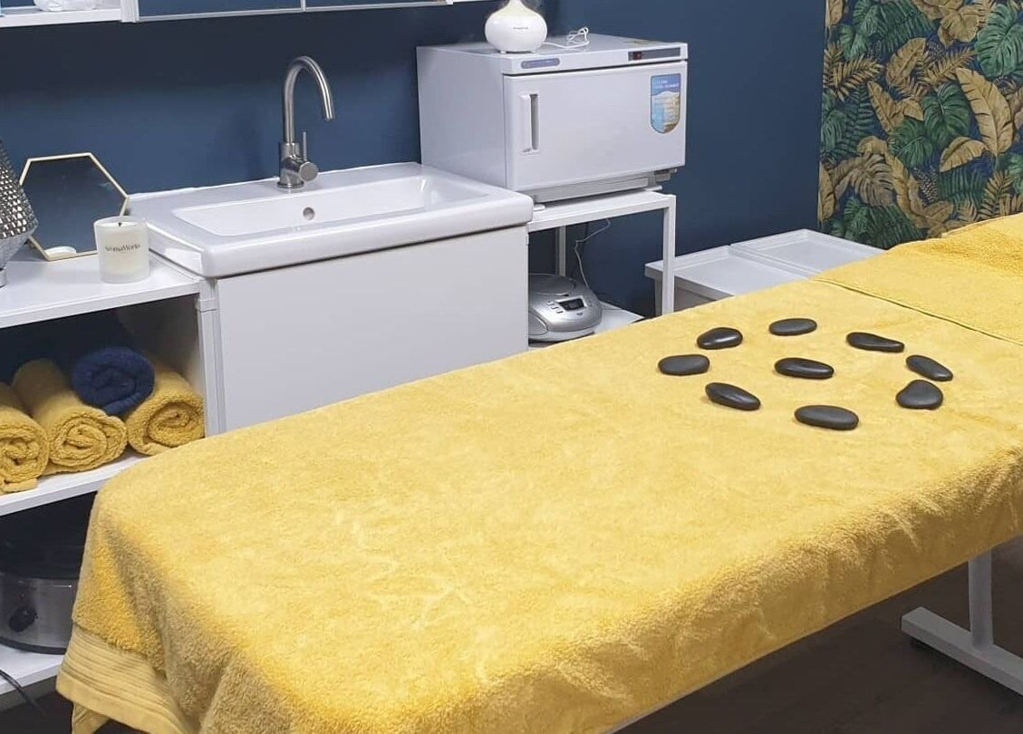 Tranquil treatment room at First Impressions, Shifnal, England, GB, featuring a massage table and calming decor.