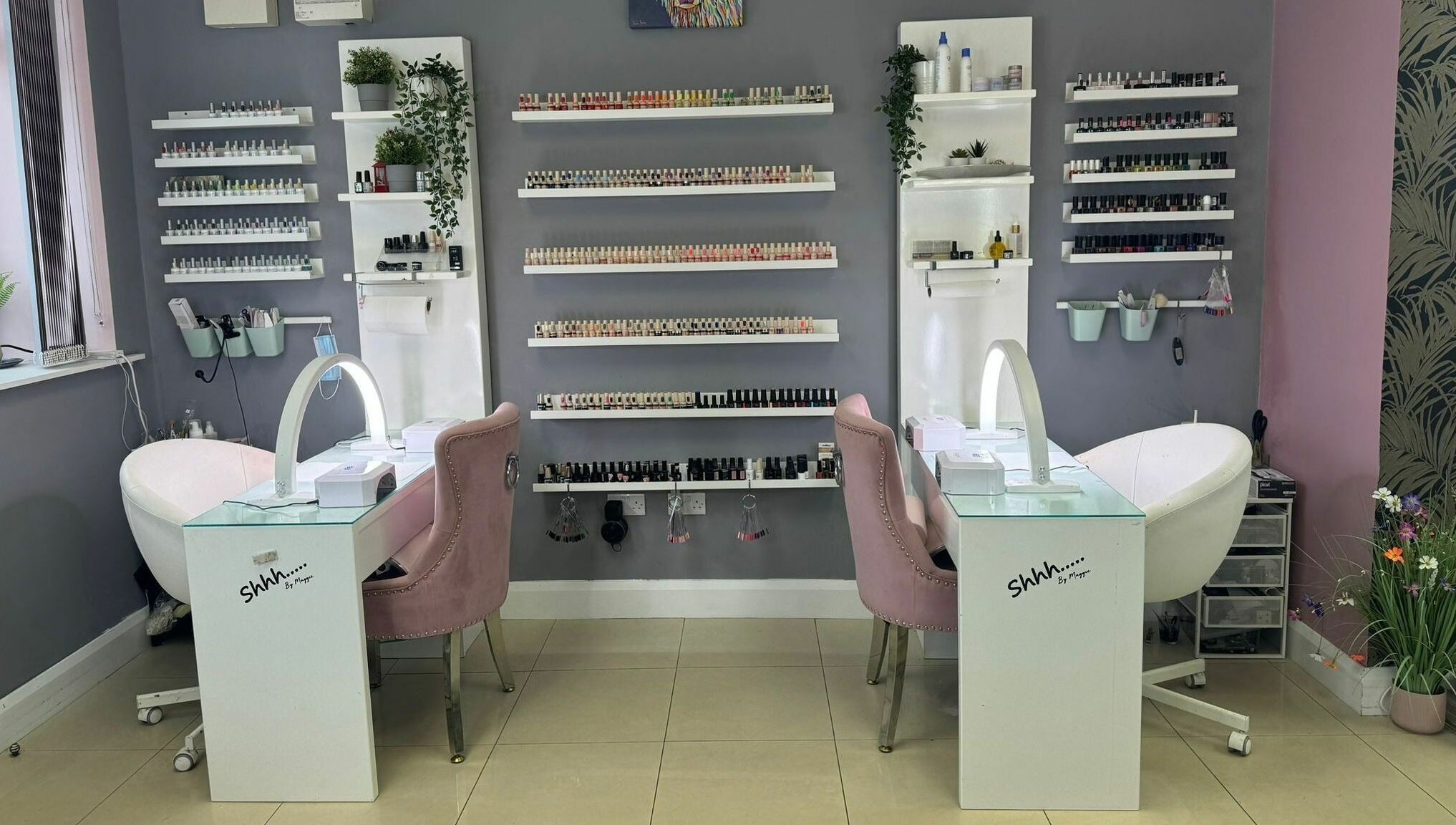 Chic nail salon setup at Shhh... by Maggie, Virginia, County Cavan, IE, featuring stylish chairs and nail polish display.