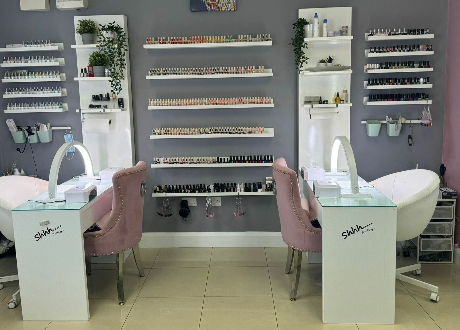 Chic nail salon setup at Shhh... by Maggie, Virginia, County Cavan, IE, featuring stylish chairs and nail polish display.