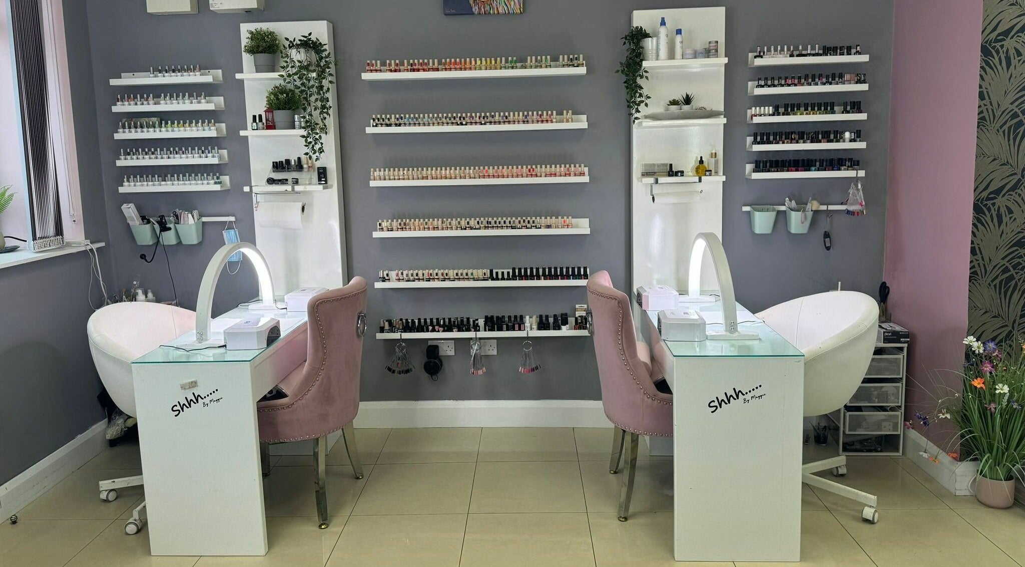 Chic nail salon setup at Shhh... by Maggie, Virginia, County Cavan, IE, featuring stylish chairs and nail polish display.