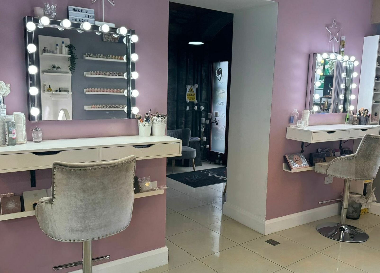 Stylish makeup station at Shhh... by Maggie in Virginia, County Cavan, IE with chic lighting and decor.
