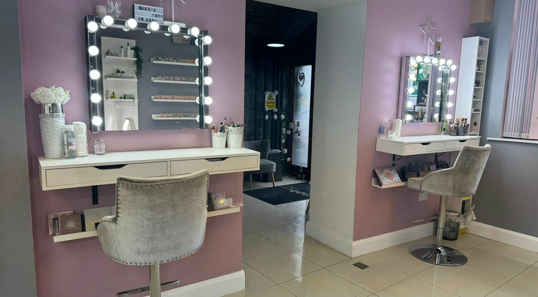 Stylish makeup station at Shhh... by Maggie in Virginia, County Cavan, IE with chic lighting and decor.