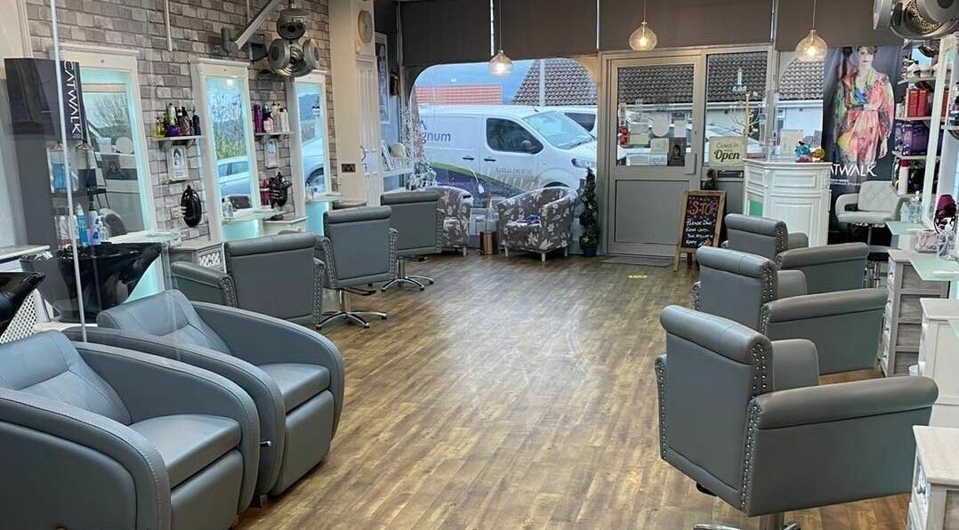 Modern salon interior at Envy Hair and Beauty Studio in Weston-super-Mare, England, GB with stylish seating.
