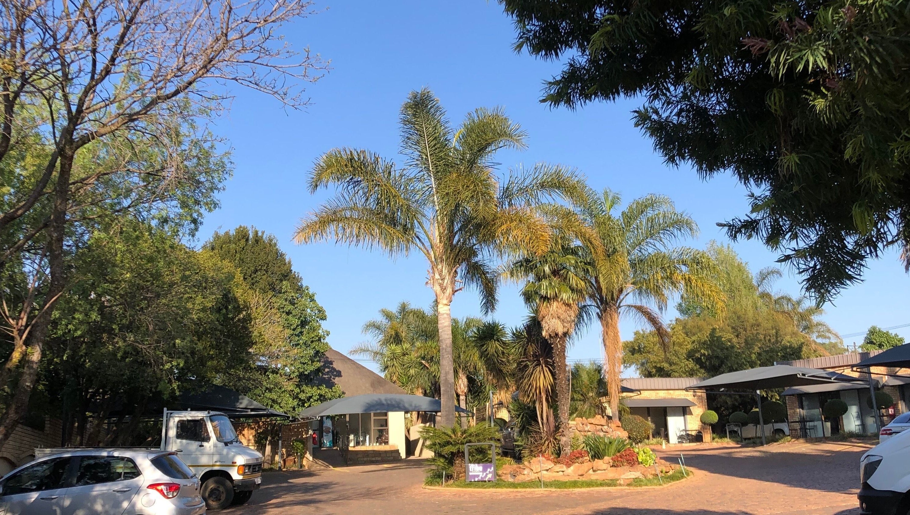 Entrance to The Wax Pots Ruimsig with lush greenery in Roodepoort, Gauteng, ZA.