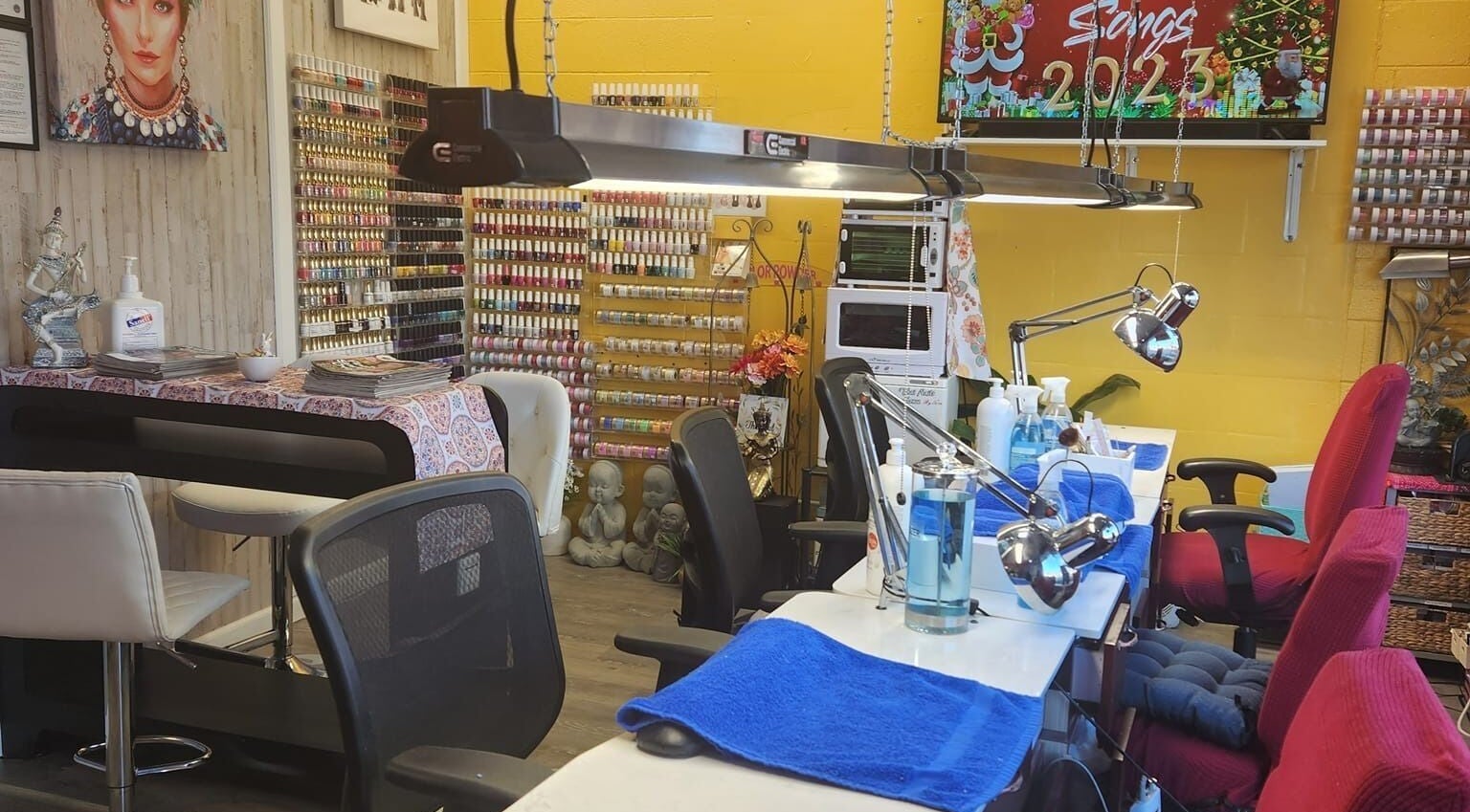 Bright interior of Thai Nails House by Ann, Denver, Colorado, US, featuring colorful nail polish display and cozy seating.
