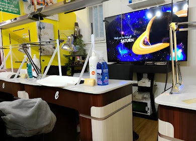Modern nail stations at Thai Nails House by Ann in Denver, Colorado, US, featuring vibrant decor and bright atmosphere.