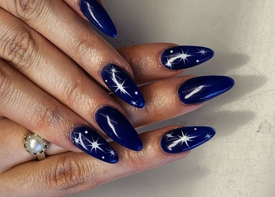 Elegant blue nails with starry design at Thai Nails House by Ann, Denver, Colorado, US.