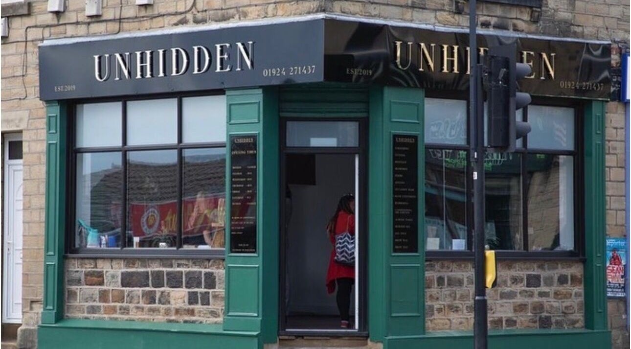 Street view of Hair by Demi at UNHIDDEN, Ossett, England, GB showcasing elegant storefront and entrance.